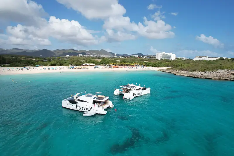 Drone picture where you see the catamarans from PyratZ anchored at Mullet Bay Beach