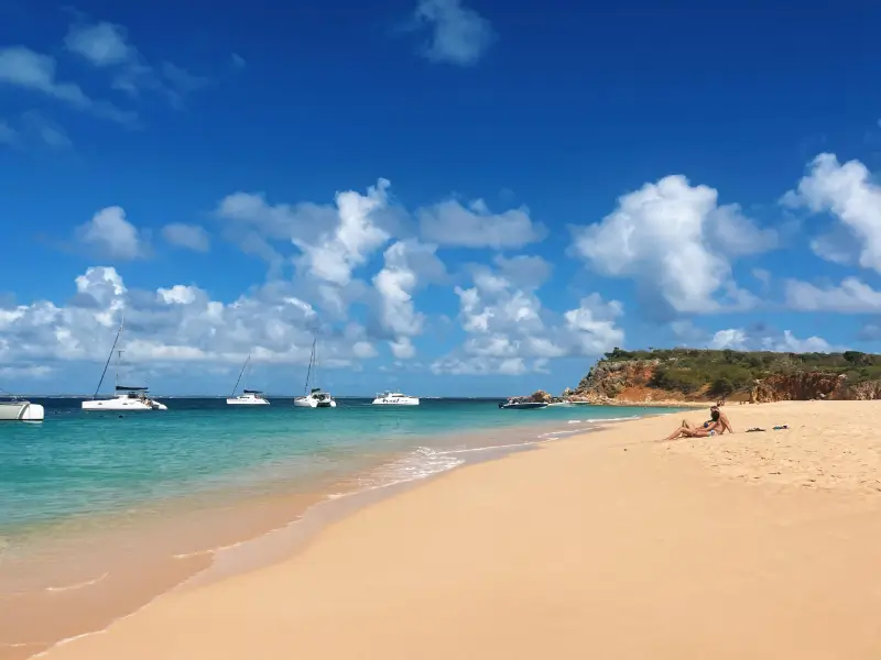 Couple relaxing at the beach of Tintamarre