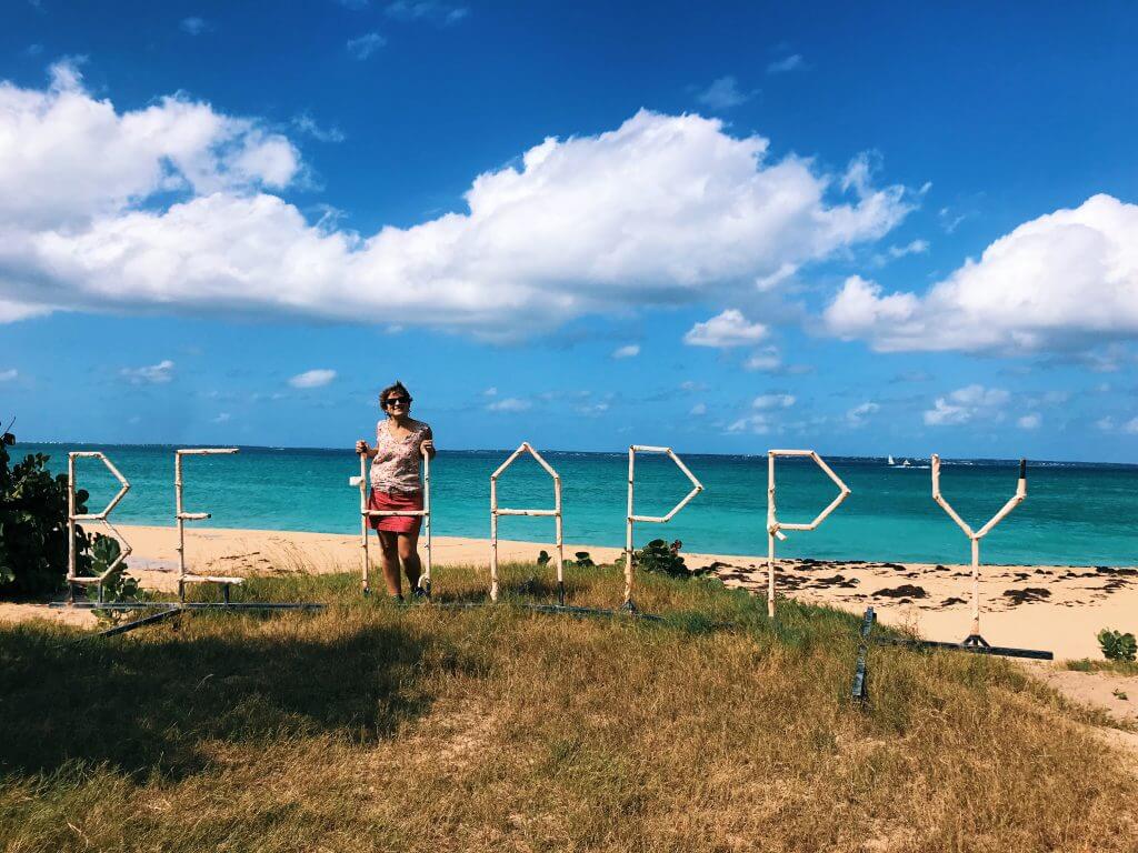 Famous "Be Happy" sign located at the back of Happy Bay, a little hidden from the beach
