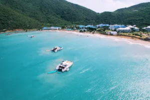 Drone view of Pyratz motor catamaran EG and Galaxy anchored near the shore at Anse Marcel Beach