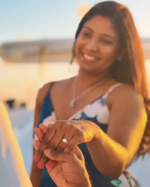 Woman showing a ring after receiving a proposal