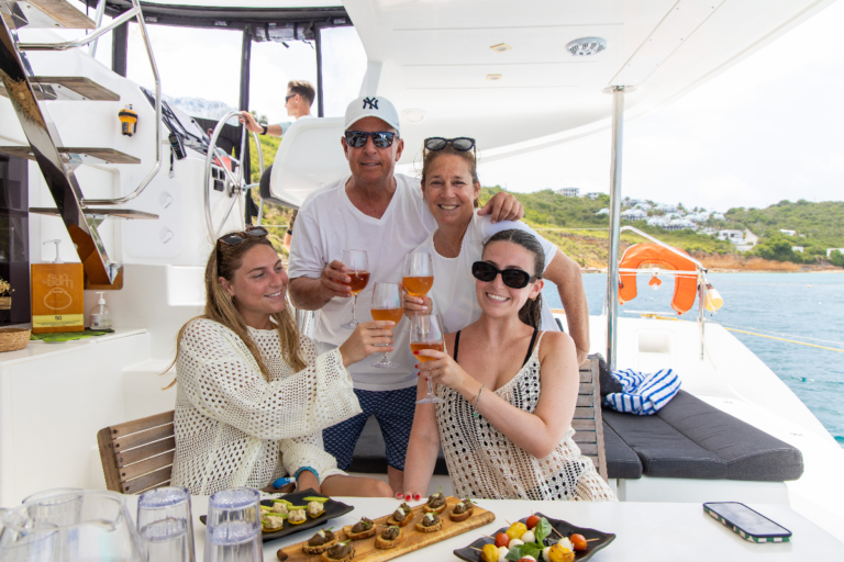 Family toasting with champagne during one of our overnight charters in St Martin