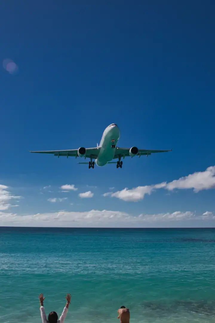 Plane landing at Sint Maarten as seen from Maho Beach