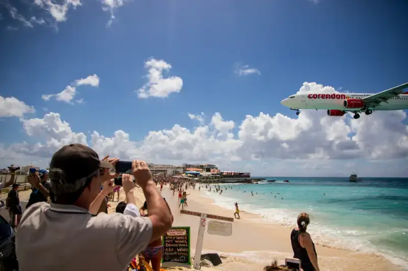 Small propeller engine plane landing at Sint Maarten
